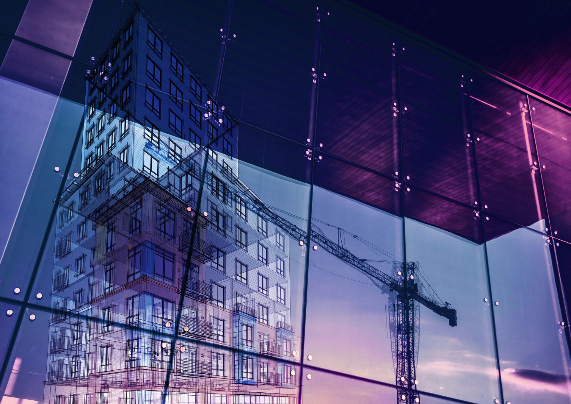 Construction crane and a new high rise building reflected into a newly built office building